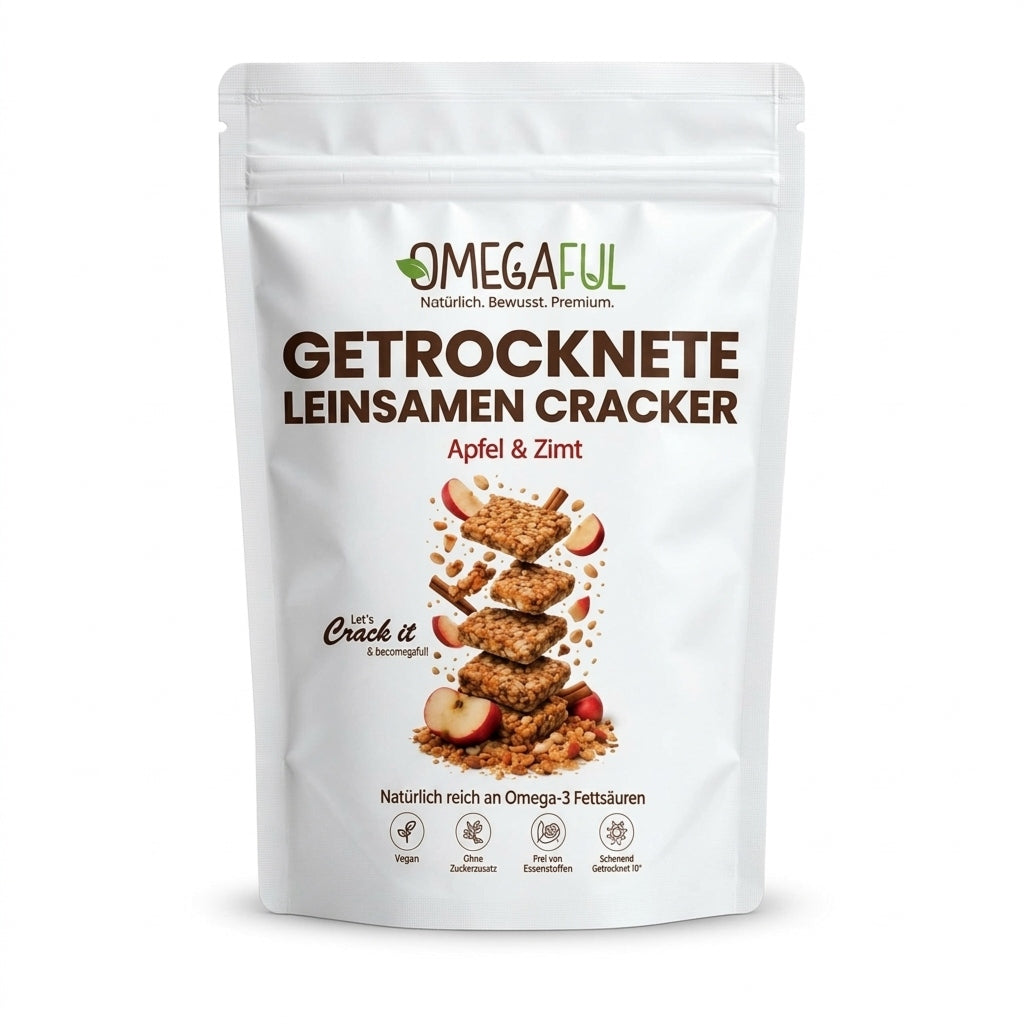 A white stand-up pouch of OMEGAFUL Getrocknete Leinsamen Cracker (dried flaxseed cracker) with apple and zimt flavor, featuring a graphic of stacked crackers with apple slices on a clean white background.